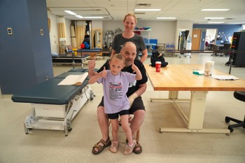 Rob's family played a huge role in his recovery. Pictured here is Rob, his wife Heather, and his granddaughter Lilly.